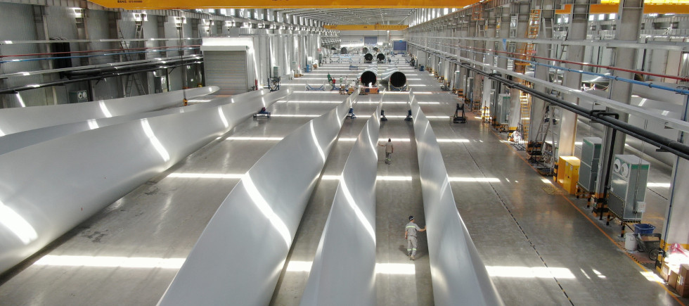 Employees inspect wind turbine blades at a workshop of Shanghai Aeolon Wind Energy Technologies Development (Group) Co Ltd. on May 13, 2020 in Nantong, Jiangsu Province of China.