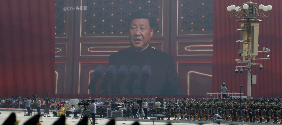 A huge screen shows Chinese President Xi Jinping delivering a speech at the start of a parade to mark the 70th anniversary of the founding of the People's Republic of China, in Beijing, Tuesday, Oct. 1, 2019. (AP Photo/Mark Schiefelbein)