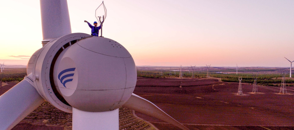 Aerial photo workers inspect equipment at a wind power photovoltaic field in Ulanhot, Hinggan League, Inner Mongolia, China, May 23, 2023