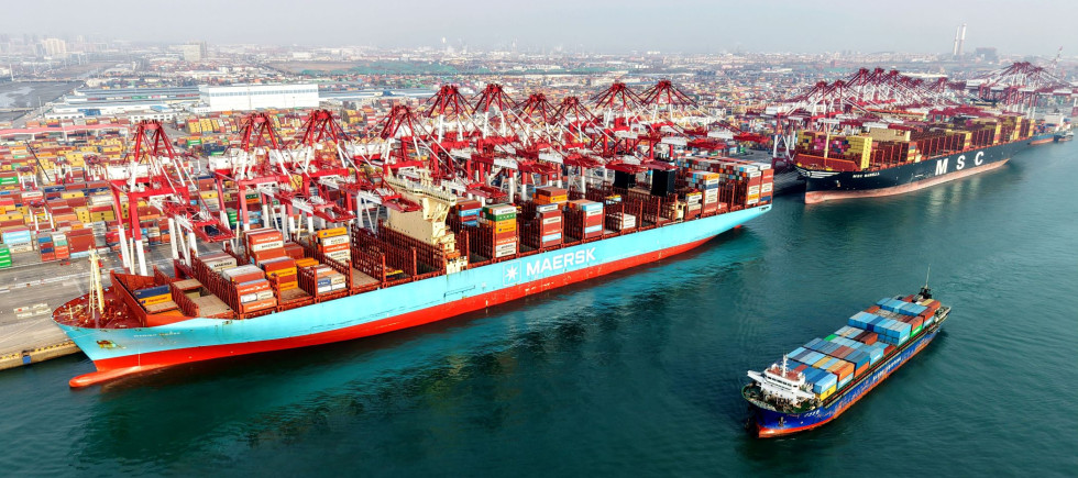 A cargo ship is loading and unloading foreign trade containers at the Qingdao Port Automated Terminal in Shandong Province, China on January 14, 2026