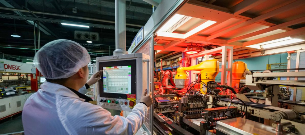 A worker is producing an export order for photovoltaic equipment on a company's production line in Sihong County Economic Development Zone, Suqian City, Jiangsu Province, China on February 24, 2026