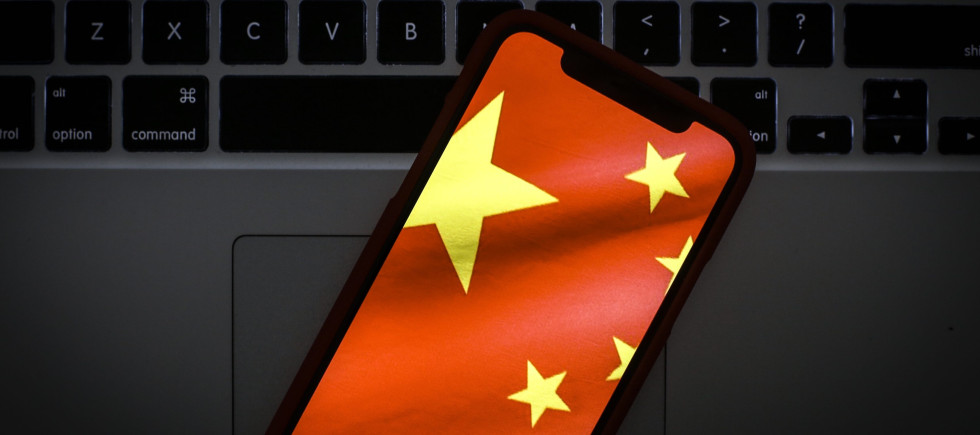 The Chinese flag is seen on a portable mobile device in this photo illustration 