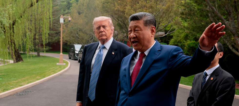 Chinese President Xi Jinping, center, gestures as he greets U.S. President Donald Trump at Zhongnanhai Garden in Beijing, Friday, May 15, 2026.