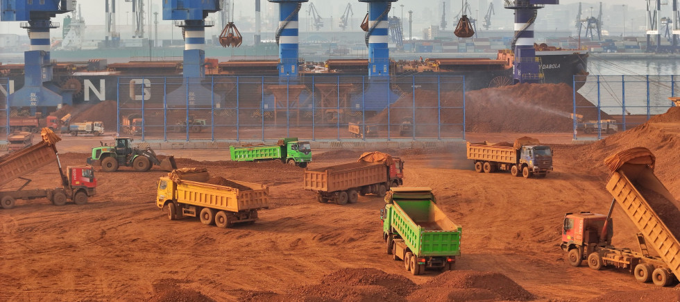 Trucks dump bauxite imported from Guinea into a pile at a ore dock in Yantai in eastern China's Shandong province, Wednesday, March 25, 2026. Bauxite smelters produce rare-earth elements (REEs) as a byâproduct, Credit:TANG KE / Avalon