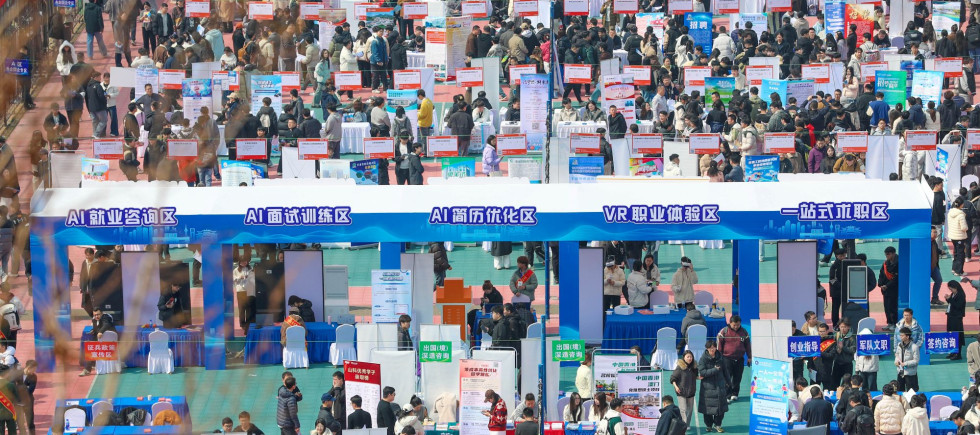 College students search for suitable positions at the Shandong University of Science and Technology campus job fair in Qingdao, Shandong Province, China on March 20, 2026.