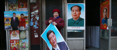 Portraits of Mao and Xi on posters