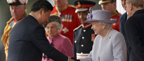 Chinese President Xi Jinping, left, shakes hands with Britain's Queen Elizabeth II in London Tuesday, Oct. 20, 2015, on the first day of their state visit to the United Kingdom. 