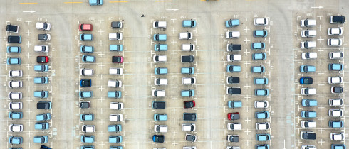 energy vehicles out of a parking lot at a logistics park in Liuzhou