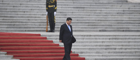 Xi Jinping walks down steps at the Great Hall of the People