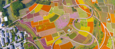 An aerial photo taken on September 29, 2021 shows a five-star red flag composed of autumn flowers in a patch of Flowers in Santaishan Forest Park in Suqian City, Jiangsu Province, China.