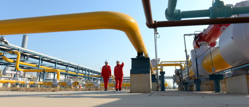 Technicians inspect pipelines at a liquefied natural gas (LNG) terminal operated by China Petrochemical Corporation (Sinopec Group)