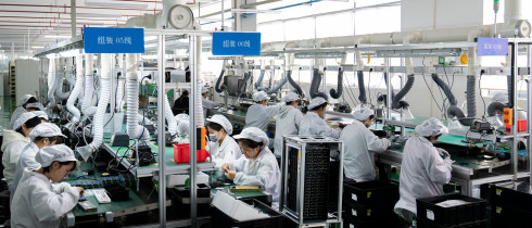 Workers work on a production line to produce electrical products for domestic and Southeast Asian markets in Nantong