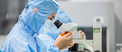 A worker prepares an order for export light filters at a workshop in Nantong, Jiangsu province, China.