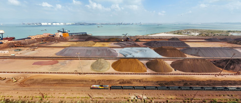 A train pulls into Dongwu port District to carry an inbound iron ore unloaded by a foreign ship in Putian, Fujian province, China, Sept 29, 2022