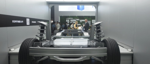 Visitors watch CATL launch its power battery automatic replacement technology at the 2023 Shanghai Auto Show in Shanghai, China.