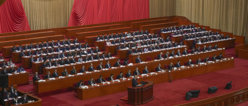 Chinese Premier Li Qiang speaks from a lectern during the opening session of the National People's Congress (NPC) at the Great Hall of the People in Beijing, China, Wednesday, March 5, 2025. 