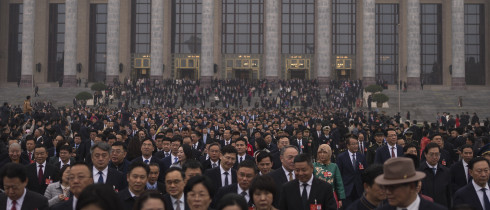 Delegates leave the Great Hall of the People after attending the closing ceremony of the National People's Congress in Beijing, Tuesday, March 11, 2025.