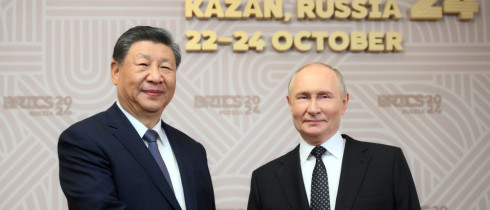 Russian President Vladimir Putin, right, welcomes Chinese President Xi Jinping, for the 16th BRICS summit at the Kazan Kremlin