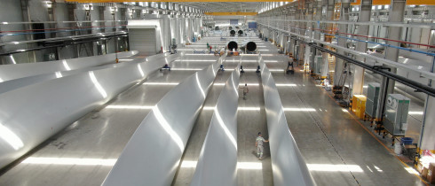 Employees inspect wind turbine blades at a workshop of Shanghai Aeolon Wind Energy Technologies Development (Group) Co Ltd. on May 13, 2020 in Nantong, Jiangsu Province of China.