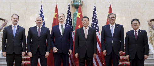 In this photo released by Xinhua News Agency, Chinese Vice Premier He Lifeng, center right, and U.S. Treasury Secretary Scott Bessent, center left, pose for a group photo with delegations before their meeting to discuss China-U.S. trade, in London, Monday, June 9, 2025.