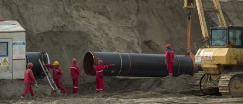Workers labor at the construction site of the China-Russia east route natural gas pipeline in Hai'an in eastern China's Jiangsu province Saturday, March 12, 2022.