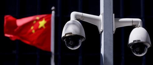 Security cameras in front of a Chinese flag