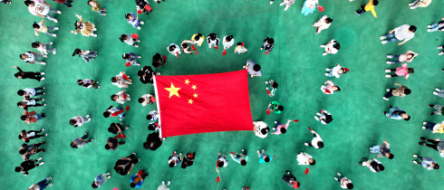 Kindergarten children pose with national flags in Lianyungang, Jiangsu province, China.
