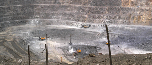 In this photo taken Tuesday, July 6, 2010, workers use machinery to dig at a rare earth mine in Baiyunebo mining district 