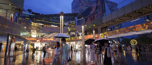 People shop at Taikoo Li Sanlitun in Beijing, China, Tuesday, July 2, 2024.