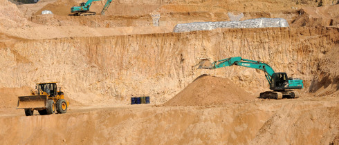 Workers use machinery to dig at a rare earth mine in Ganxian county in central China's Jiangxi province on Dec. 30, 2010.