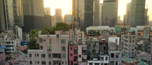 A sharp contrast between Xian village and skyscrapers around in Guangzhou city, south China's Guangdong province.