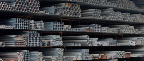 Steel products piled up in the steel market in Yichang, Hubei, China on December 13, 2025.