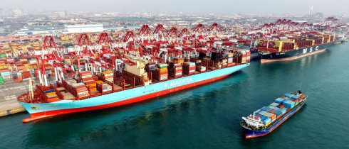 A cargo ship is loading and unloading foreign trade containers at the Qingdao Port Automated Terminal in Shandong Province, China on January 14, 2026