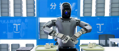 A humanoid robot from "Walker" series of UBTECH conducts sorting work at the Beijng World of Robots in Beijing