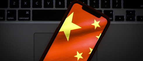 The Chinese flag is seen on a portable mobile device in this photo illustration 