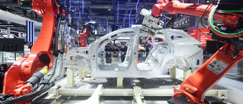 Robots make cars at the China International Industrial Expo in Shanghai