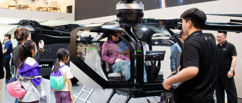 Visitors check out the cockpit section of Xpeng Aeroht's modular flying car 'Land Aircraft Carrier' at the 2026 Beijing Auto Show in Beijing, 28 April, 2026.