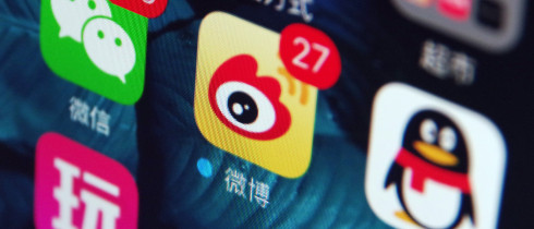 Icons of the messaging apps Weixin (WeChat), left, QQ, right, and Weibo, center