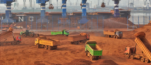 Trucks dump bauxite imported from Guinea into a pile at a ore dock in Yantai in eastern China's Shandong province, Wednesday, March 25, 2026. Bauxite smelters produce rare-earth elements (REEs) as a byâproduct, Credit:TANG KE / Avalon