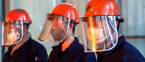 Chinese workers survey the production of steel at a plant of Qingdao Special Iron and Steel Co., Ltd. in Qingdao city.